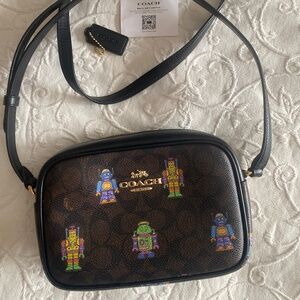 🤖 Cosmic Coach Mini Jamie Camera Bag In Signature canvas robots